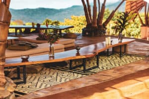 Open-air lounge deck at Holos overlooking the rainforest