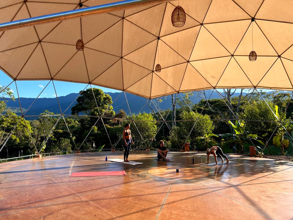 Open-air geodesic yoga dome at Holos overlooking the rainforest